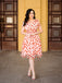 She slips into this Pink 1950s Strawberry Mesh Swing Dress and suddenly it's a 1950s daydream