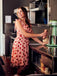 She slips into this Pink 1950s Strawberry Mesh Swing Dress and suddenly it's a 1950s daydream