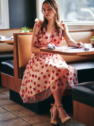 She slips into this Pink 1950s Strawberry Mesh Swing Dress and suddenly it's a 1950s daydream