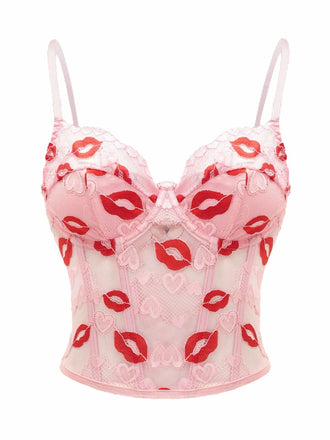 She slips into Pink 1950s Valentine's Day Kiss Print Lace Corset and channels 1950s screen sirens