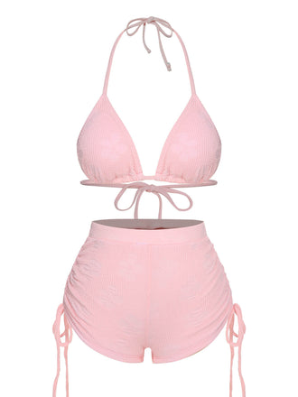 She's wearing Pink 1960s Floral Lace-Up Halter Swimsuit and the whole beach remembers the 1960s