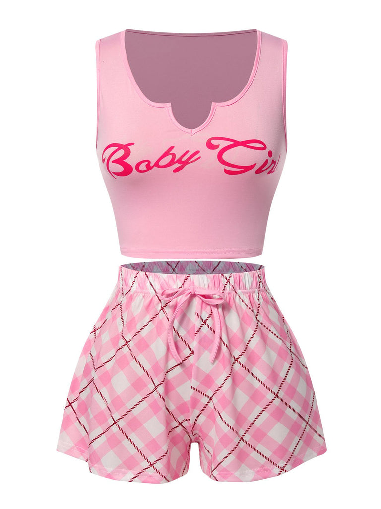 She pairs this Pink 1970s Baby Girl Tank Top & Plaid Shorts Pajamas with confidence and 1970s charm