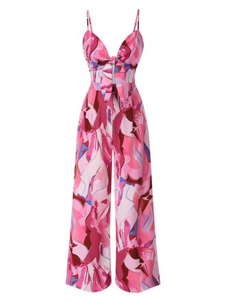 She finds her 1970s story in this Pink 1970s Strap Psychedelic Print Front-Tie Jumpsuit