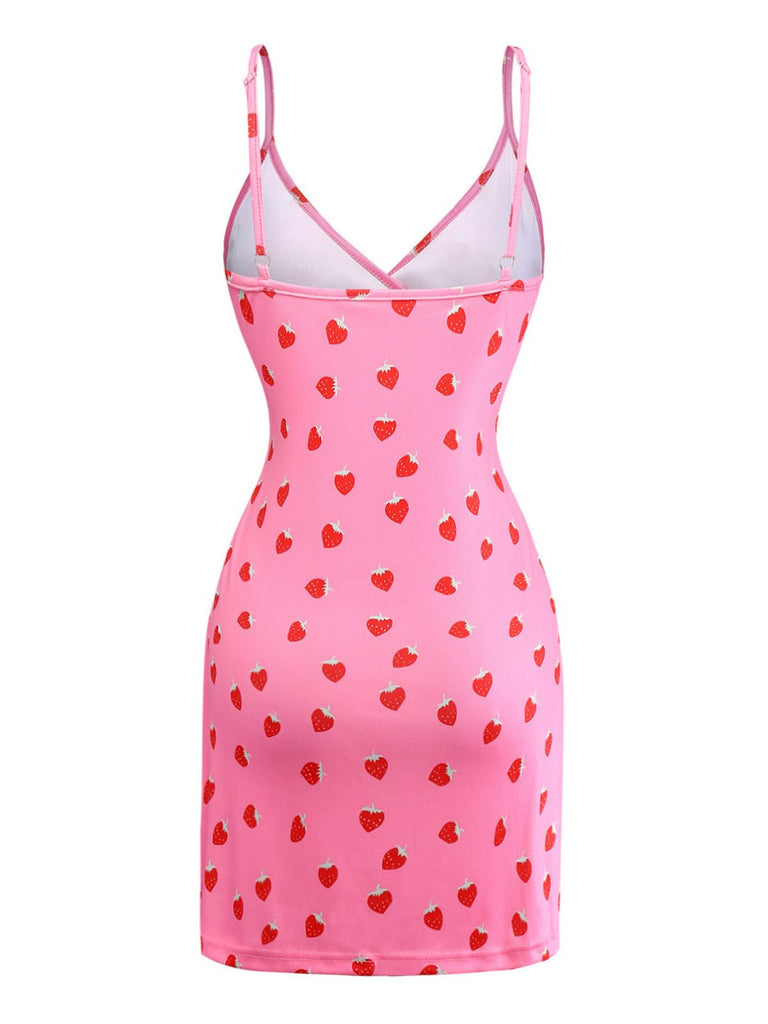 Pink slip dress with red heart pattern on a white background