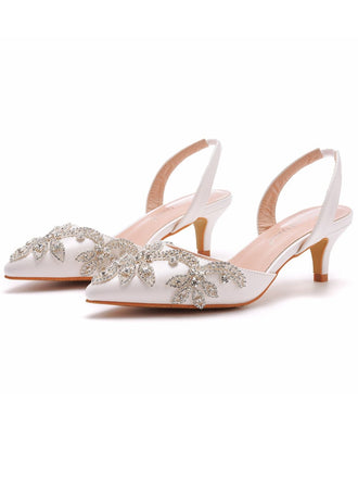 She finds her vintage story in this Pointed Rhinestoned Slingback Stiletto High Heels
