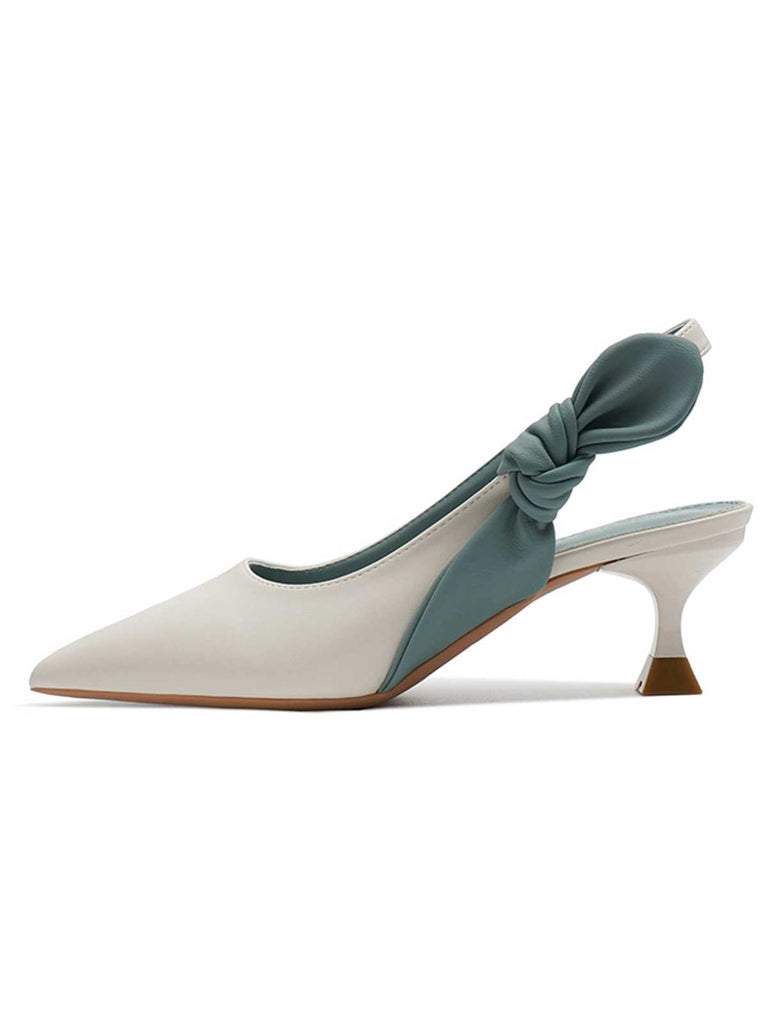She finds her vintage story in this Pointed-Toe Strappy Stiletto Sandals