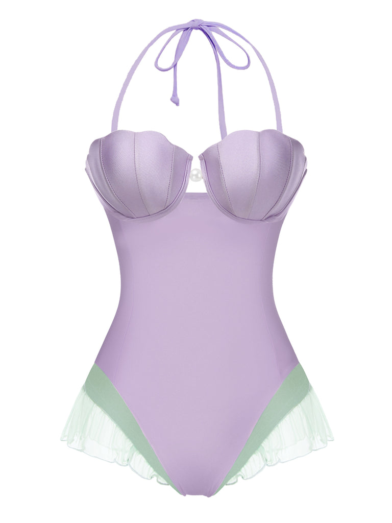 This Purple 1970s Shell Mermaid Bandeau One-Piece Swimsuit carries 1970s vacation dreams in every stitch