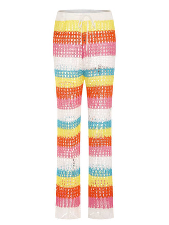 She's wearing Rainbow 1970s Hollow Knitted Beach Pants and the whole beach remembers the 1970s