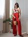 She finds her 1930s story in this Red 1930s Halter Deep V-Neck Roses Jumpsuit