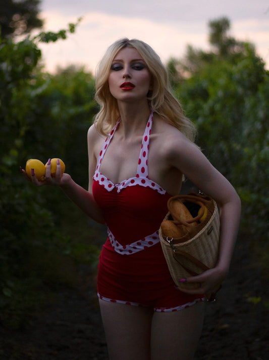 She's wearing Red 1940s Halter Patchwork One-piece Swimsuit and the whole beach remembers the 1940s