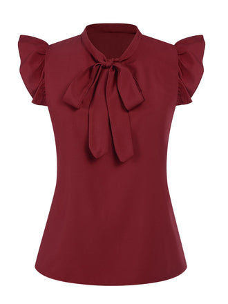 She pairs this Red 1940s Solid Tie-Neck Ruffle Sleeve Blouse with confidence and 1940s charm