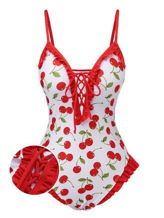 She's wearing Red 1950s Cherry Lace-Up Ruffled Swimsuit and the whole beach remembers the 1950s