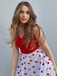 She slips into this Red 1950s Heart Bow Sleeveless Dress and suddenly it's a 1950s daydream
