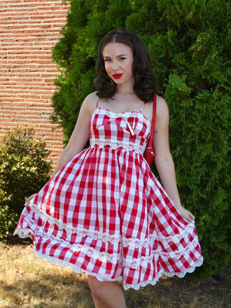She slips into this Red 1950s Plaid Lace Bow Strap Dress and suddenly it's a 1950s daydream