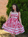 She slips into this Red 1950s Plaid Lace Bow Strap Dress and suddenly it's a 1950s daydream