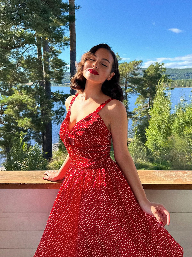She slips into this Red 1950s Spaghetti Strap Heart Print Dress and suddenly it's a 1950s daydream