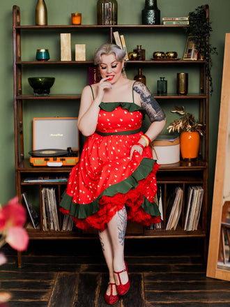 She slips into this Red 1950s Strawberry Ruffle Belt Dress and suddenly it's a 1950s daydream