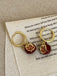 She adds this Red Pomegranate Charm Earrings and suddenly it's vintage perfection