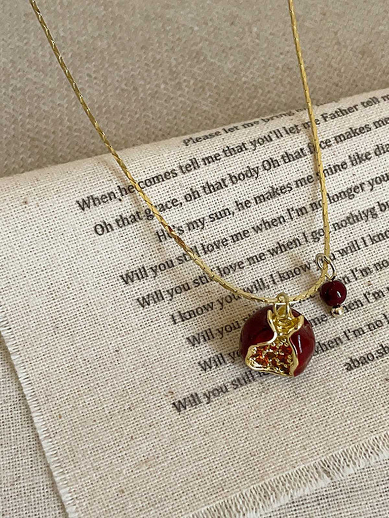 This Red Pomegranate Pendant Necklace carries vintage stories waiting to be told