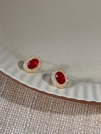 She adds this Red Vintage Oval Crystal Diamond Earrings and suddenly it's 1950s perfection
