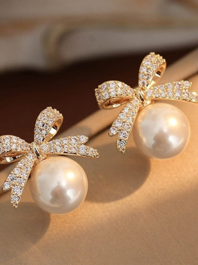 Retro Bow Rhinestone Pearl Earrings — 1950s elegance in the palm of her hand