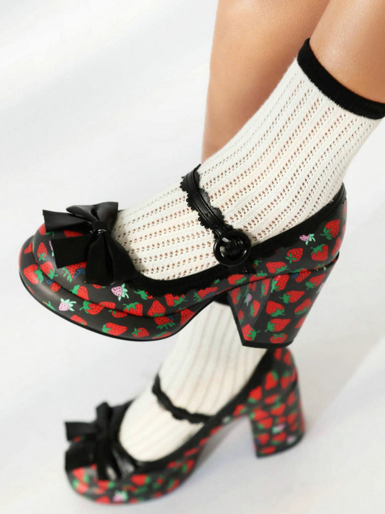 She finds her 1950s story in this Retro Leather Strawberry Bow Chunky Heels