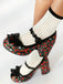 She finds her 1950s story in this Retro Leather Strawberry Bow Chunky Heels