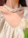 She adds this Retro Multi-Layered Pearl Pendant Necklace and suddenly it's 1950s perfection