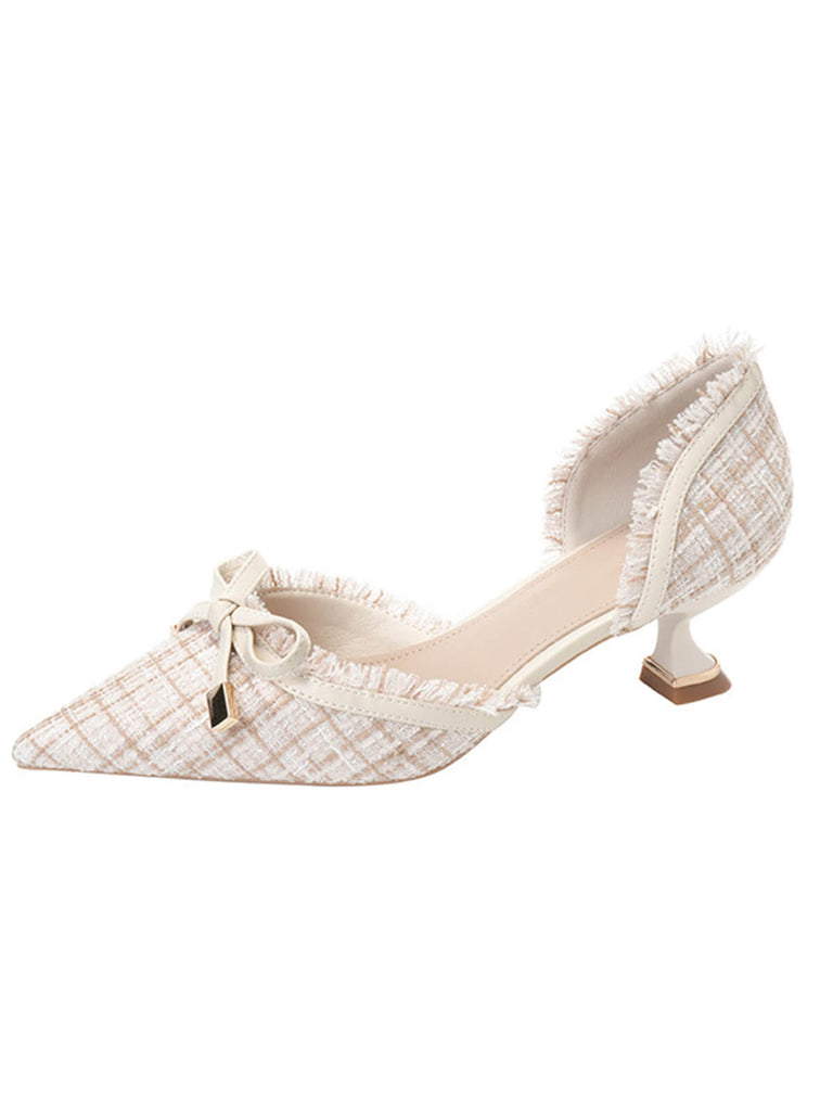 She finds her 1950s story in this Retro Tweed Bow Kitten Pointed Heels