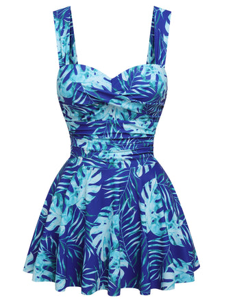 She's wearing Royal Blue 1960s Tropical Plants Swimsuit Set and the whole beach remembers the 1960s