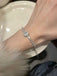 She slips into Silver Alloy Diamond Bracelet and channels vintage screen sirens