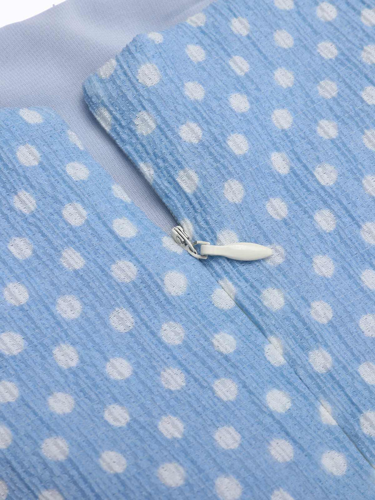 She slips into this Sky Blue 1950s Strap Polka Dot Swing Dress and suddenly it's a 1950s daydream