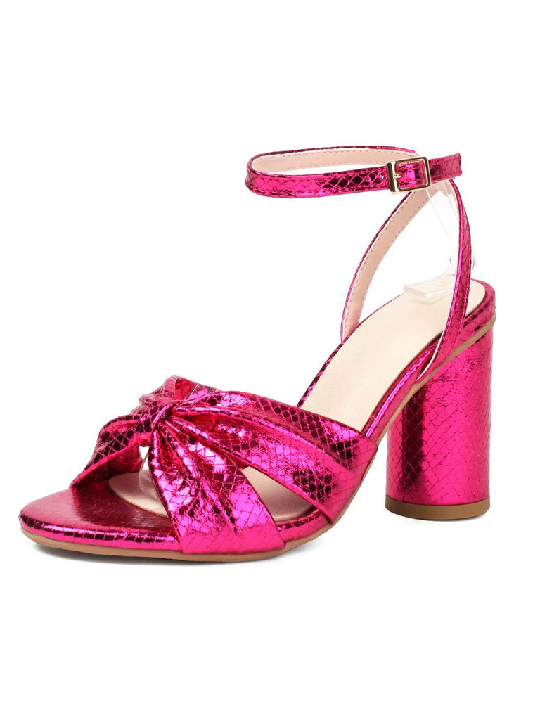 She finds her vintage story in this Snakeskin Print Round Toe Heels