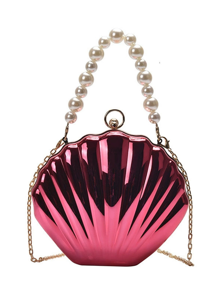 She adds this Solid Metal Shell Bag and suddenly it's vintage perfection