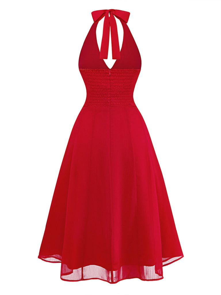 Vibrant red 1940s rose print midi dress with halter neck and lace-up back, perfect for a vintage-inspired garden party or romantic summer date.