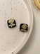 She adds this Vintage Black & Gold Cubic Flower Earrings and suddenly it's 1950s perfection