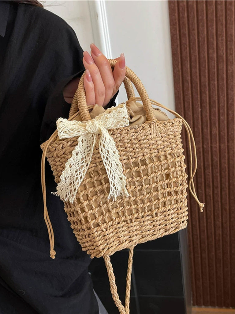 She adds this Vintage Boho Bow Straw Handbag and suddenly it's 1950s perfection