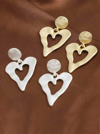 She adds this Vintage Chic Heart Alloy Earrings and suddenly it's 1950s perfection