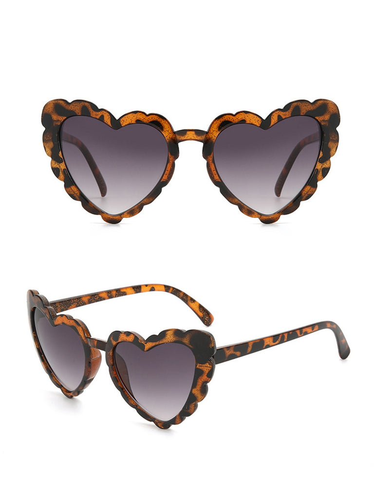 She finds her 1950s story in this Vintage Curved Heart Frame Sunglasses