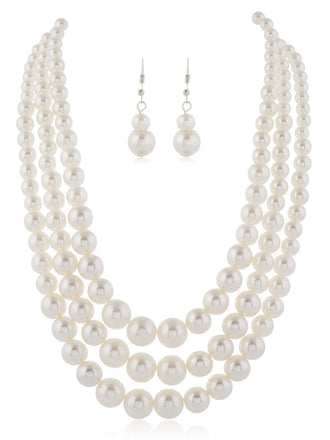 She adds this Vintage Layered Pearl Necklace & Earring Set and suddenly it's 1950s perfection
