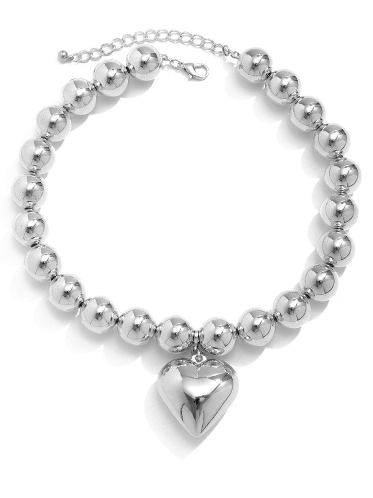 She adds this Vintage Heart Pendant Necklace and suddenly it's 1950s perfection