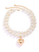 She adds this Vintage Heart Pendant Necklace and suddenly it's 1950s perfection