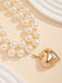 She adds this Vintage Heart Pendant Necklace and suddenly it's 1950s perfection