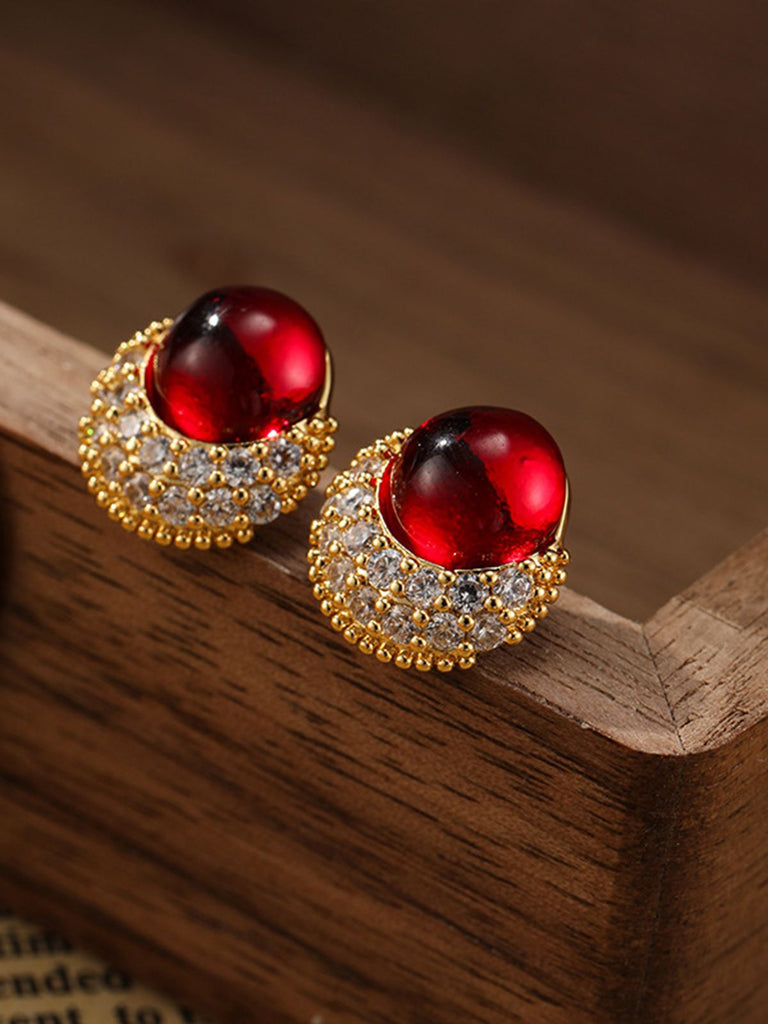 She adds this Vintage Rhinestone Ruby Alloy Stud Earrings and suddenly it's 1950s perfection