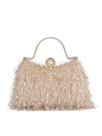 She adds this Vintage Tassel Evening Handle Bag and suddenly it's 1950s perfection