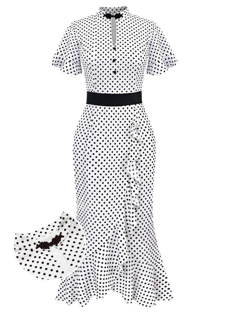 Black and white polka dot dress with a belt on a white background