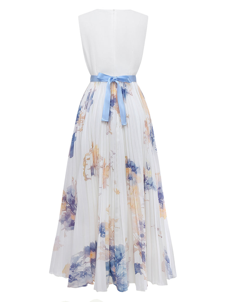 Floral dress with a white top and blue floral skirt on a white background