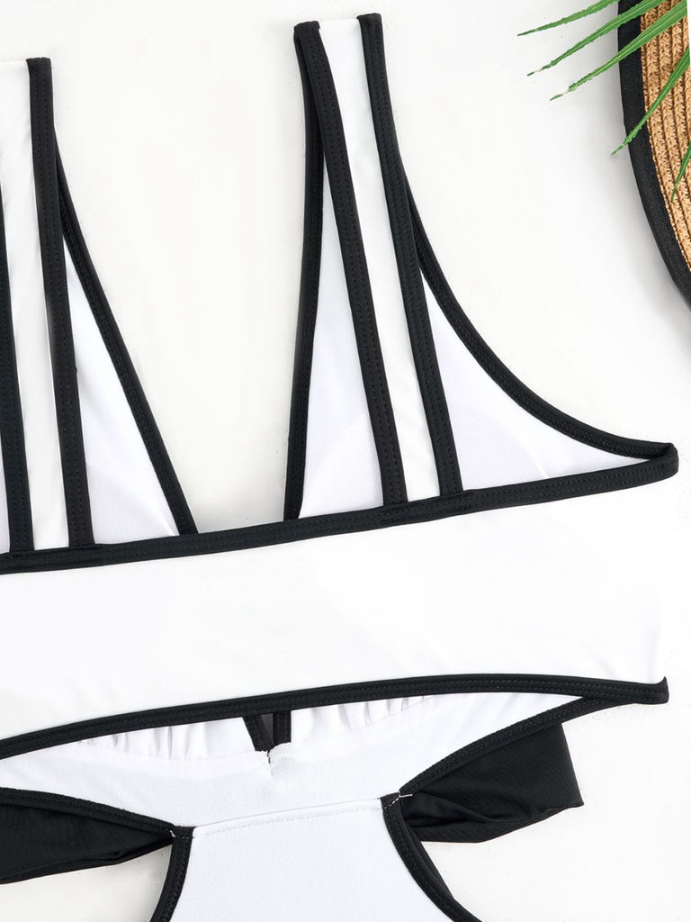 This White 1950s Waist Hollow Binding Bow Swimsuit carries 1950s vacation dreams in every stitch