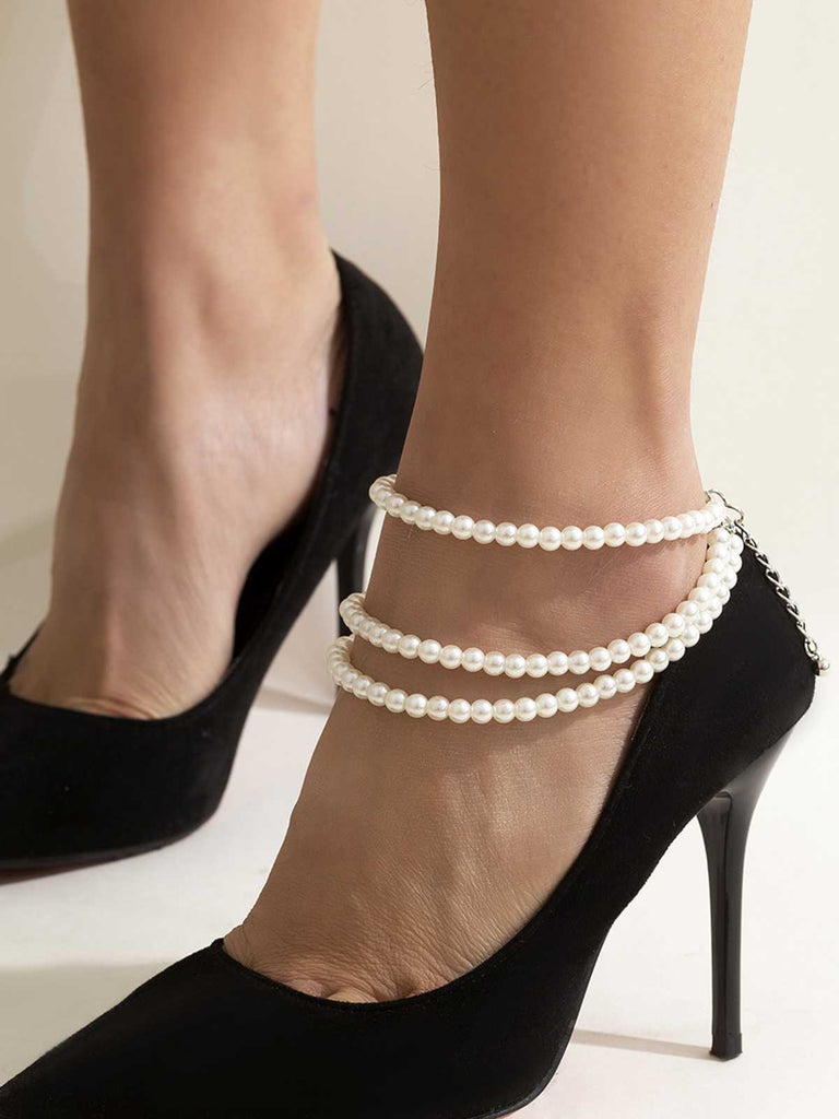 She finds her vintage story in this White Pearl Beaded Tassel Anklet