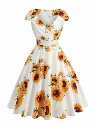She slips into this White & Yellow 1950s Sunflower Swing Dress and suddenly it's a 1950s daydream